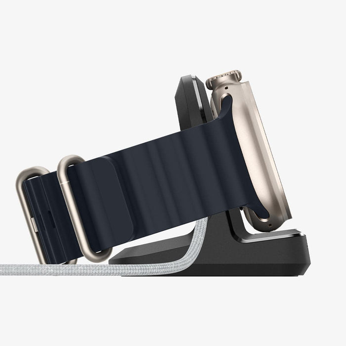 AMP05764 - Apple Watch Rugged Armor Stand in black showing the side with watch on stand