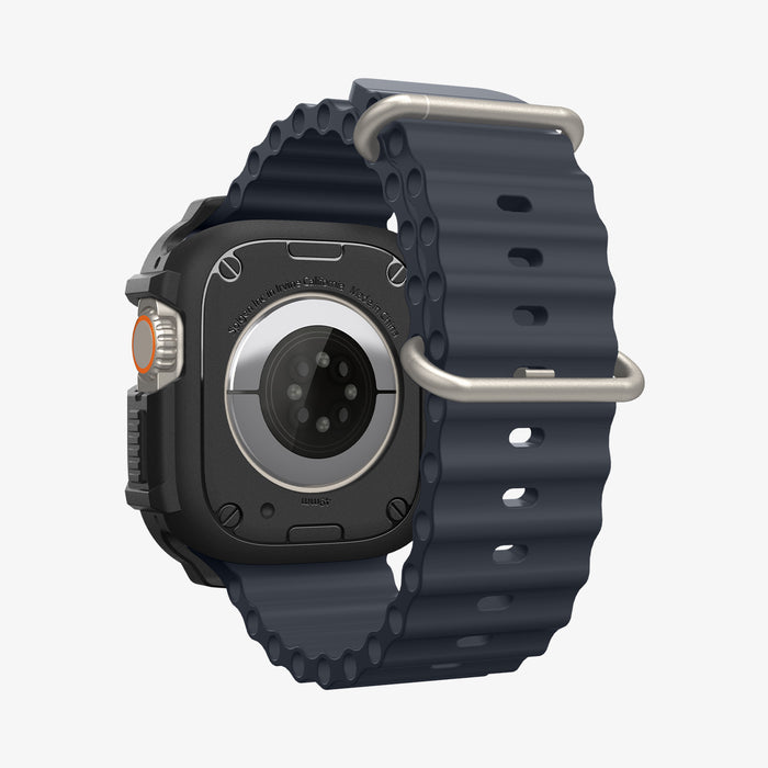 ACS11414 - Spigen Rugged Armor case for Apple Watch Ultra front view showing shock-resistant frame with carbon fiber detail, Digital Crown access, and black band