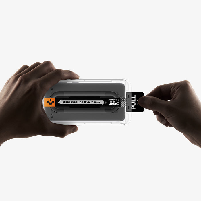 AGL11397 - Hands demonstrating step one of Spigen EZ Fit Pro Galaxy A57 5G screen protector installation pulling tab