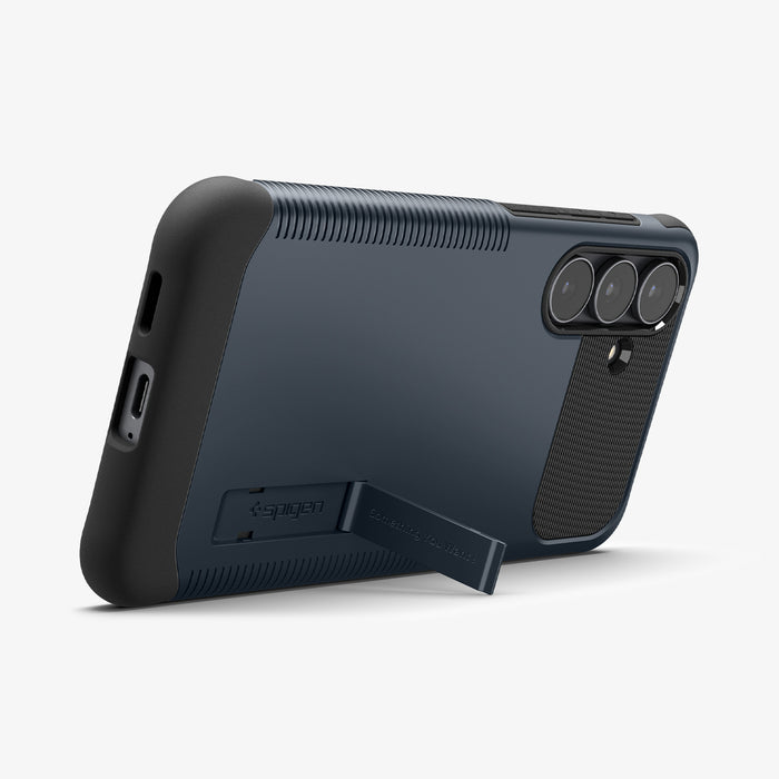 ACS11642 - Galaxy S25 FE Slim Armor (MagFit) in Metal Slate showing the back, bottom and partial side with a built-in kickstand propped up