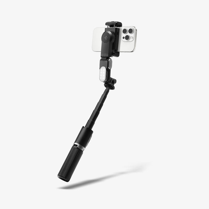 AMP08945 - Gimbal Selfie Stick | S620W in Black showing rear camera view in selfie stick mode with compact phone clamp LED fill light attached and carbon-textured grip handle