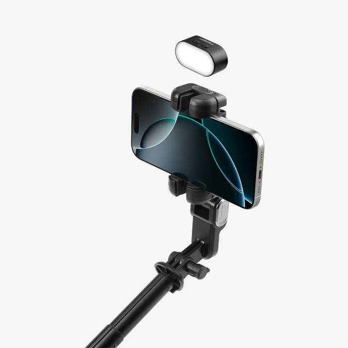 AMP08945 - Gimbal Selfie Stick | S620W in Black showing detachable magnetic LED fill light floating above phone clamp attachment point demonstrating snap-on installation