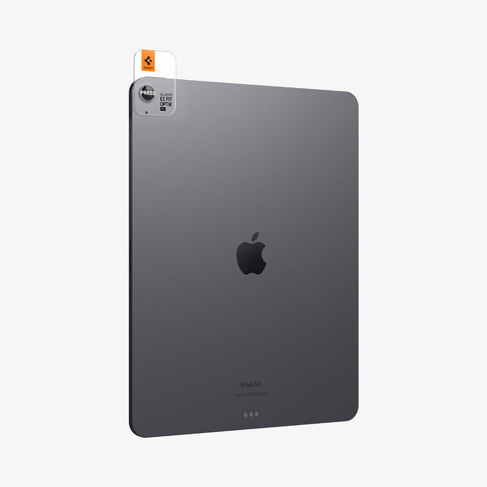 AGL07801 - Spigen Glas.tR EZ Fit Optik Pro lens protector being positioned over iPad Air 13 Space Gray camera in three-quarter back view