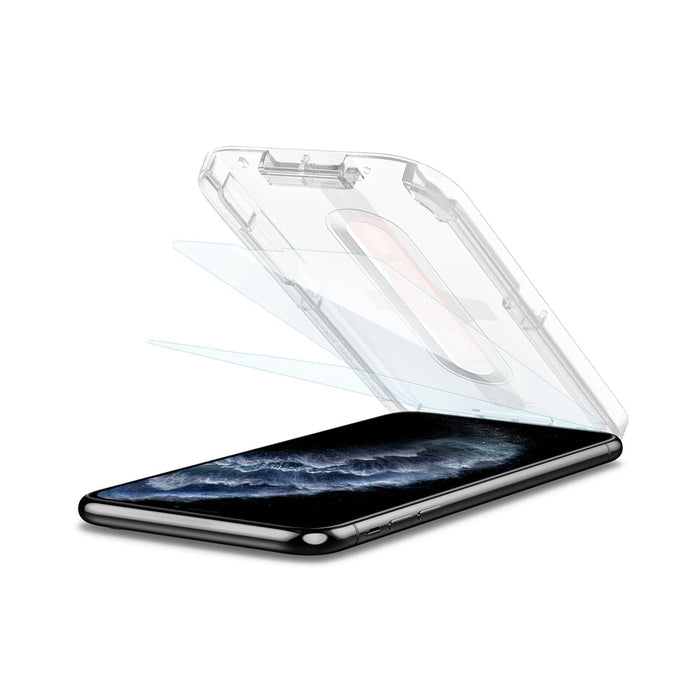 063GL25358 - iPhone 11 Pro Screen Protector GLAS.tR EZ Fit showing the device laying flat and ez fit tray with screen protector being installed