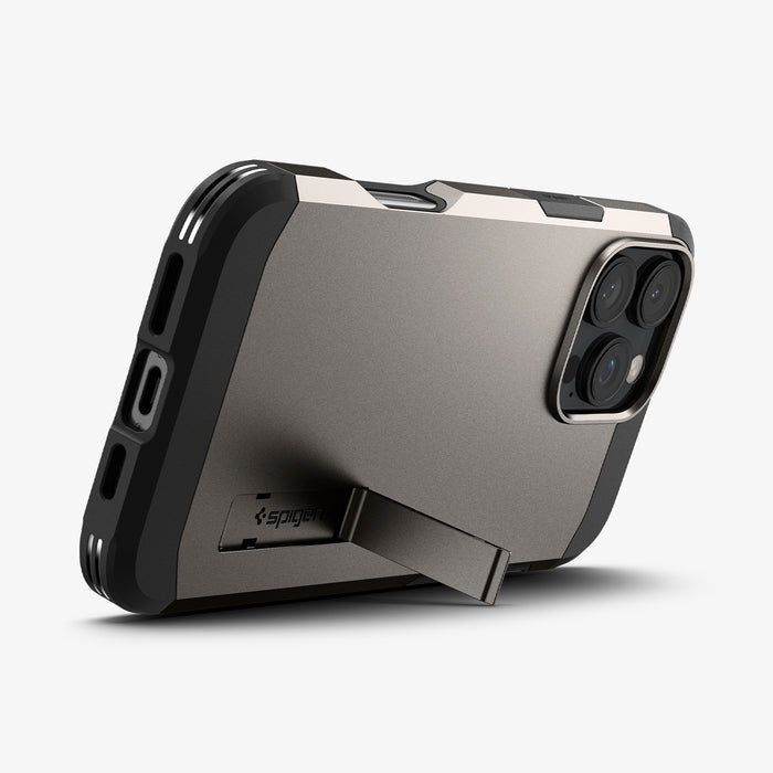 ACS08012 - iPhone 16 Pro Max Case Tough Armor AI (MagFit) in Gunmetal showing the back, partial side and bottom with built-in kickstand propped up