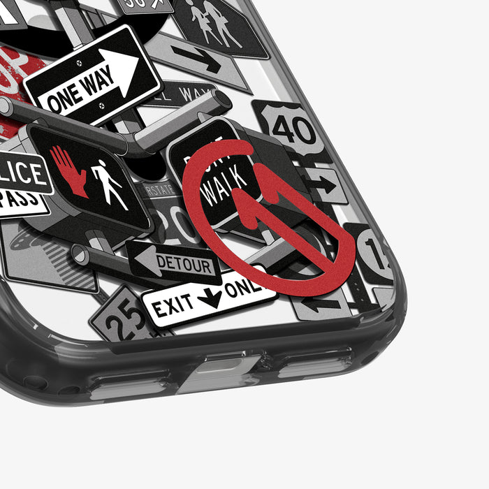 ACS11841 - Spigen Signal C11 iPhone 17 Pro Max case showing a close-up of the Spigen Signal C11 case bottom corner with Police, Detour, and Don't Walk sign graphics