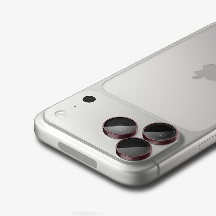AGL12044 - iPhone 18 Pro Max / iPhone 18 Pro Optik Pro EZ Fit Lens Protector in burgundy showing a close-up of three lens protectors fitted securely over the camera lenses.