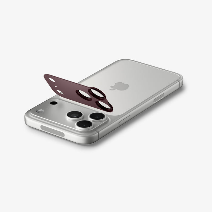 AGL12040 - iPhone 18 Pro Max Optik Pro XL EZ Fit Lens Protector in burgundy showing the lens protector aligned above the camera area before installation.