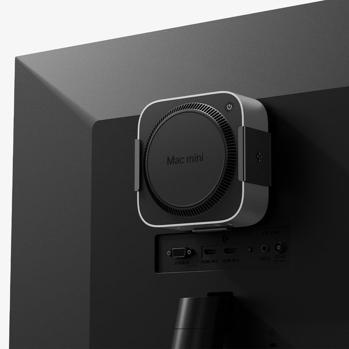 AMP09226 - Mac Mini M4 Mount LD205 in Charcoal Gray showing the front and partial sides mounted at the back of a monitor