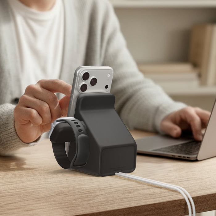 AMP09172 - Magsafe Duo Charger Stand (Mag Fit) in Black showing a person using the charger stand with the phone and watch attached.