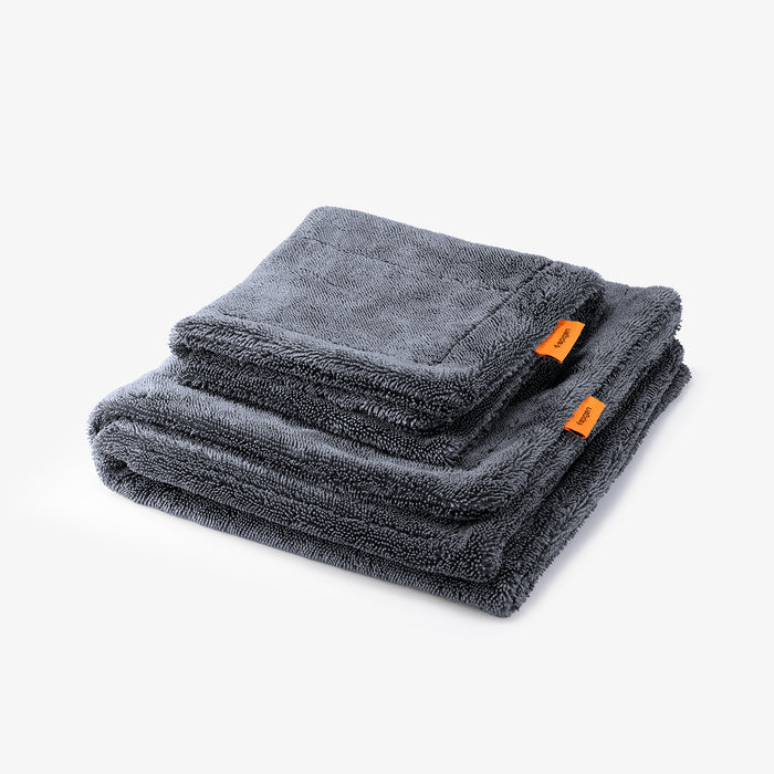 ACP11389 - Two folded gray Spigen microfiber car drying towels stacked together with orange brand tags