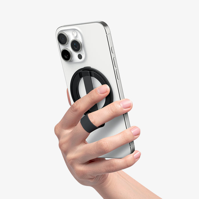 AMP08551 - O-Mag Magnetic Phone Holder (MagFit) | OM103 in Black showing a person holding the ring holder attached to the device