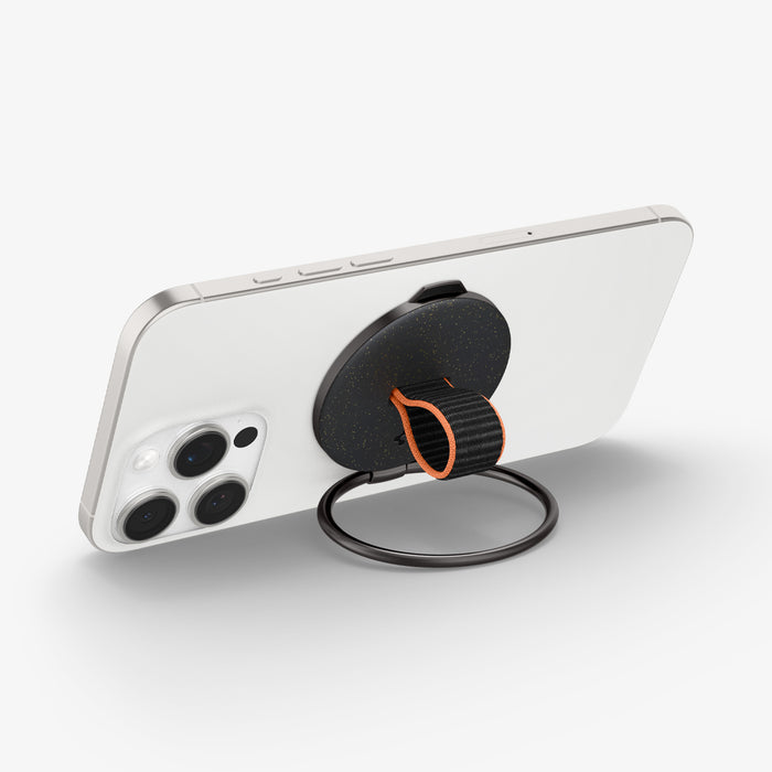 AMP08552 - O-Mag Magnetic Phone Holder (MagFit) OM104 in Black showing the back, top and side of the device o mag ring showing sides, ring propped up as a kickstand in landscape form