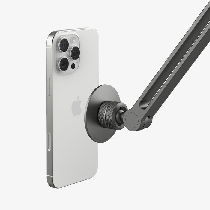 AMP09694 - Phone OneTap Clamp (MagFit) in Space Gray showing the back of the device hovering infront of the onetap clamp