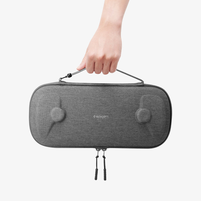 AGP09756 - Playstation portal klasden pouch showing someone holding the pouch by the strap