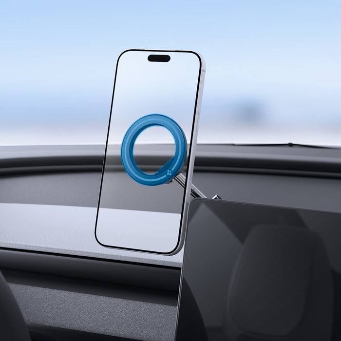 ACP11657 - Spigen MagSafe car mount holding iPhone on dashboard with magnetic ring attachment