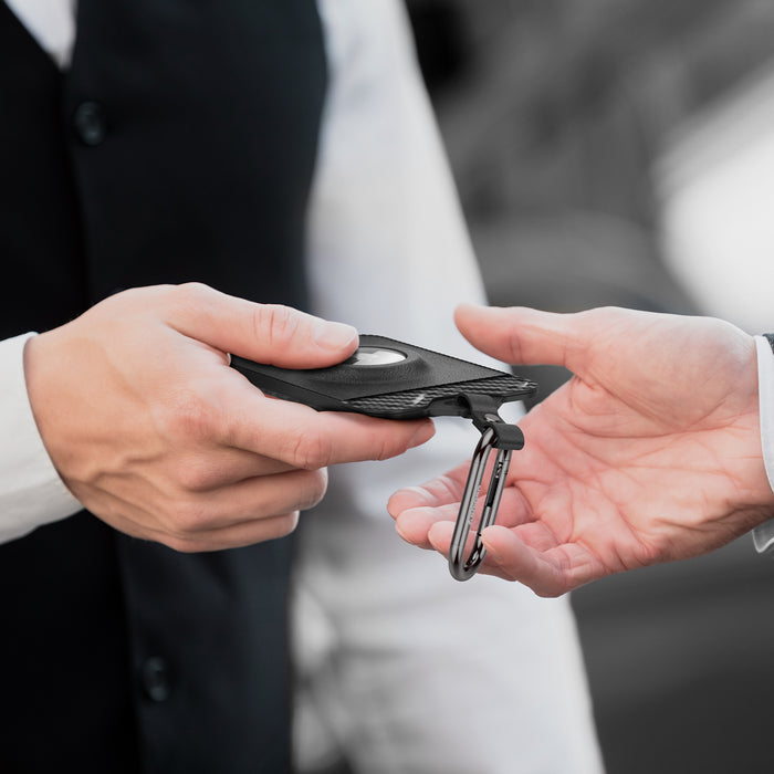 ACP08793 - Tesla AirFit Key Card Holder 2-pack | TO244 showing the key card holder being passed to someone else