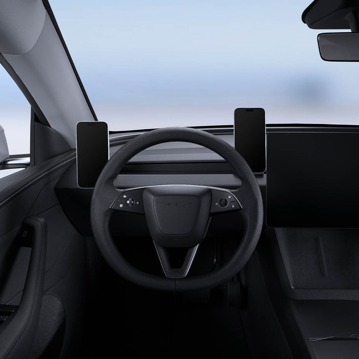 ACP11873 - Two phones mounted on Spigen magnetic mounts on either side of the steering wheel in a Tesla interior
