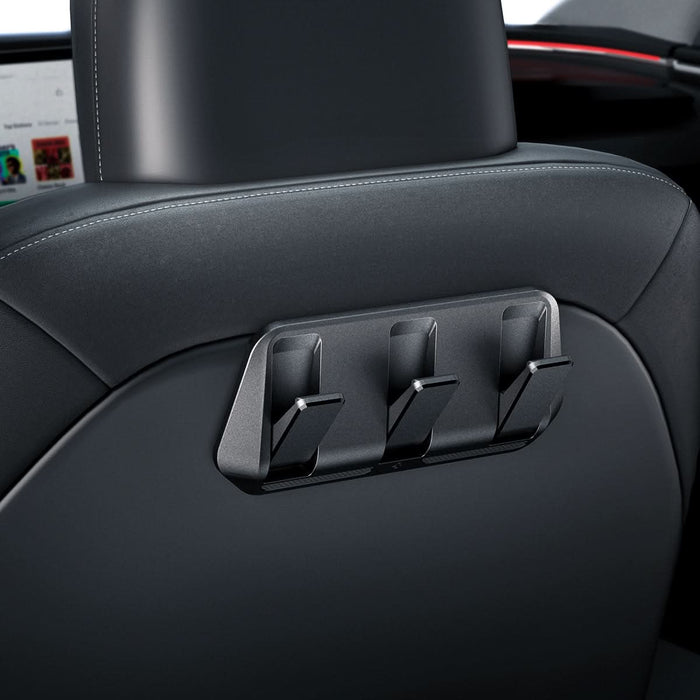 ACP09201 - Tesla Model 3 (2017-2023) Car Seat Hook TO283 in Black showing the front partial side installed at the back of the driver's seat
