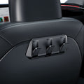 ACP09201 - Tesla Model 3 (2017-2023) Car Seat Hook TO283 in Black showing the front partial side installed at the back of the driver's seat