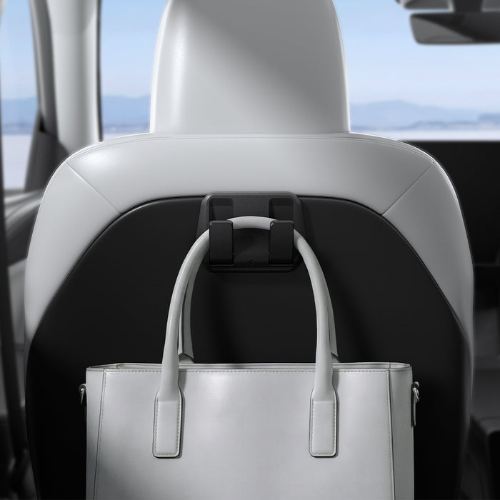 ACP11563 - Model Y Premium (2025+) in Black showing a seatback-mounted hook holding a handbag securely behind the front seat.