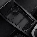 ACP11169 - Tesla Series - Center Console Organizer Lower Tray | TO220LYS in Black showing divided storage compartments with integrated cup holder and non-slip textured base installed in the center console.