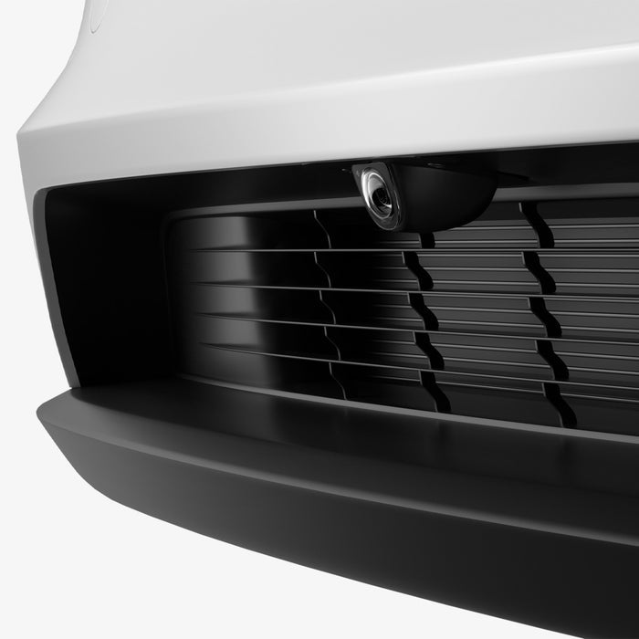 ACP11231 - Tesla Series - Front Camera Protector | TO331 showing an angled view of the front bumper camera with the protective cover installed within the grille.