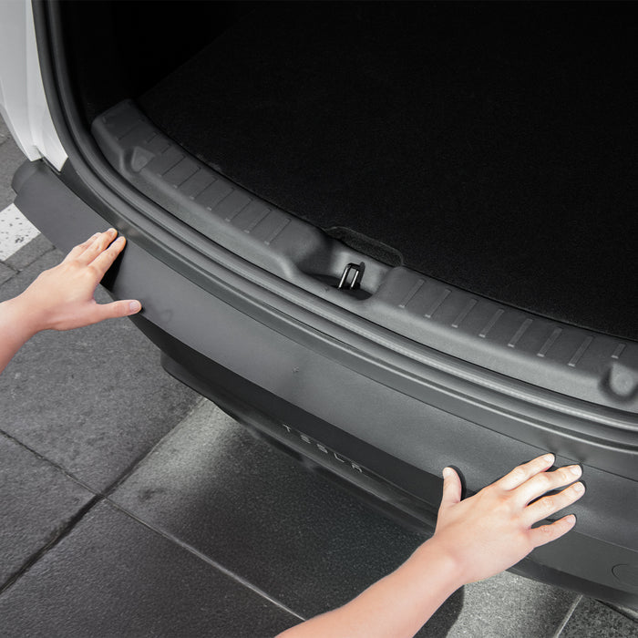 ACP10618 - Model Y Juniper (2025+) Rear Bumper Guard | TG200-YJ showing a person installing the rear bumper guard