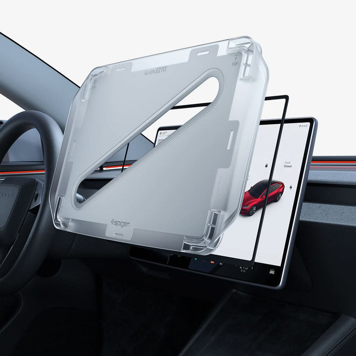 AGL10654 -  Tesla Series - Screen Protector GLAS.tR EZ Fit 15.4 showing the alignment tray hovering in front of the screen protector and the vehicle screen monitor