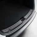 ACP09759 - Tesla Model Y Juniper Trunk Sill Guard | TG100-YJ in black showing the guard installed in trunk