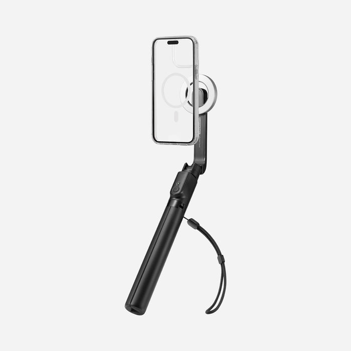 AMP07659 - Tripod Selfie Stick (Mag Fit) | S580W in Black showing an iPhone in a clear MagSafe case attached to the S580W selfie stick in handheld mode with wrist strap, displayed against a light gray background.