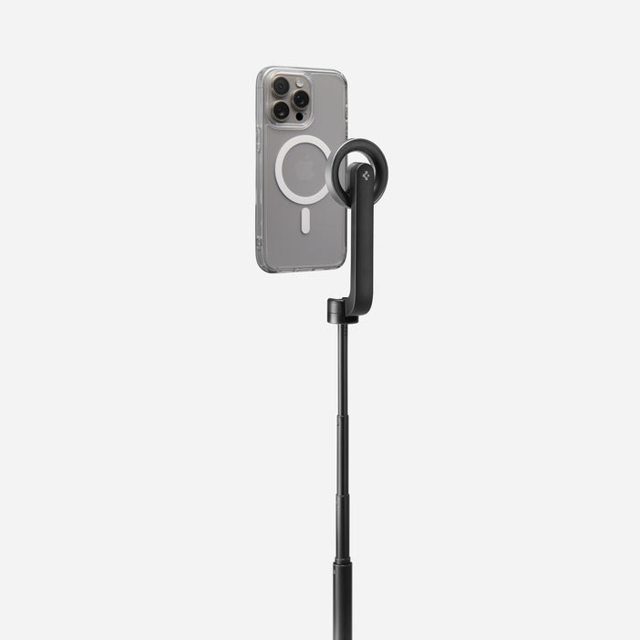 AMP07659 - Tripod Selfie Stick (Mag Fit) | S580W in Black showing an iPhone in a clear MagSafe case mounted to the S580W selfie stick in extended tripod mode, displayed against a light gray background.