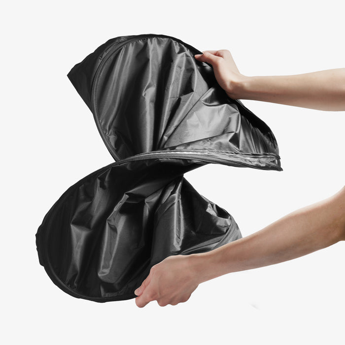 ACP11459 - Universal CryoShade UO260 S showing hands twisting sunshade into figure-eight shape during folding process